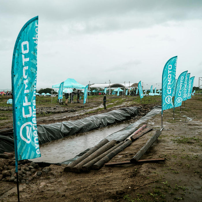 Rainy day outdoor event with CFMOTO branding in Bulakan, Central Luzon.