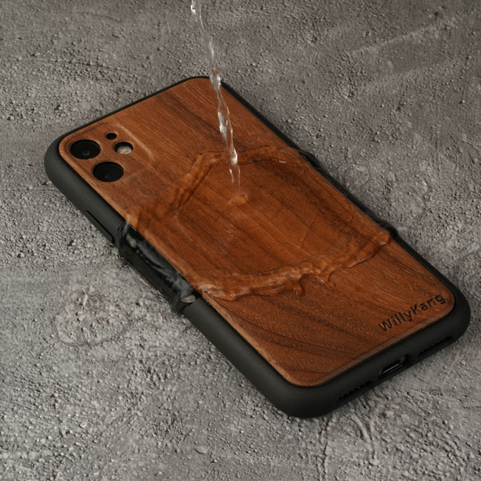 Durable waterproof wooden phone case with water pouring on a concrete background.
