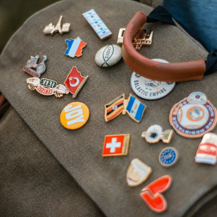 assorted-colored lapel pin lot