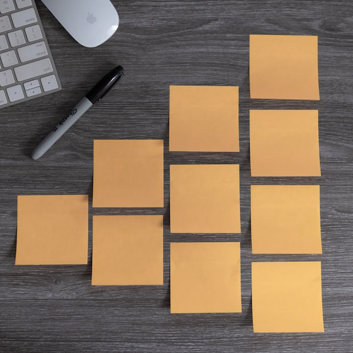 yellow sticky notes beside white apple magic mouse and white apple keyboard