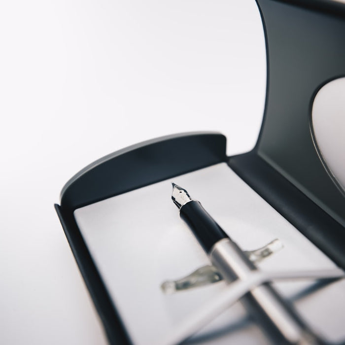 black and silver scissors on white surface
