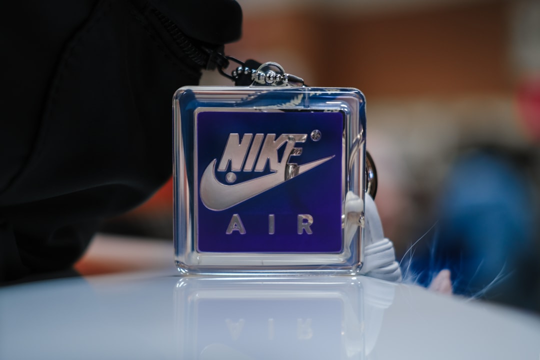 a nike air keychain sitting on top of a table