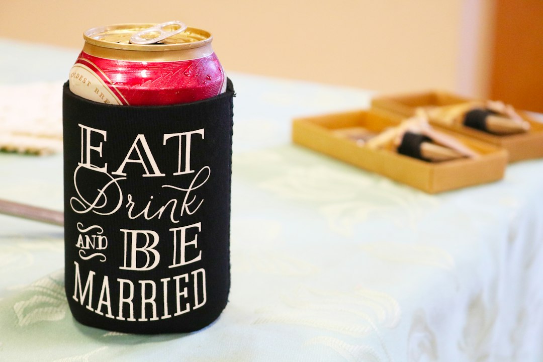black and red can on white table