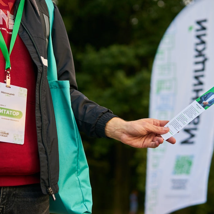 a person holding a piece of paper in their hand