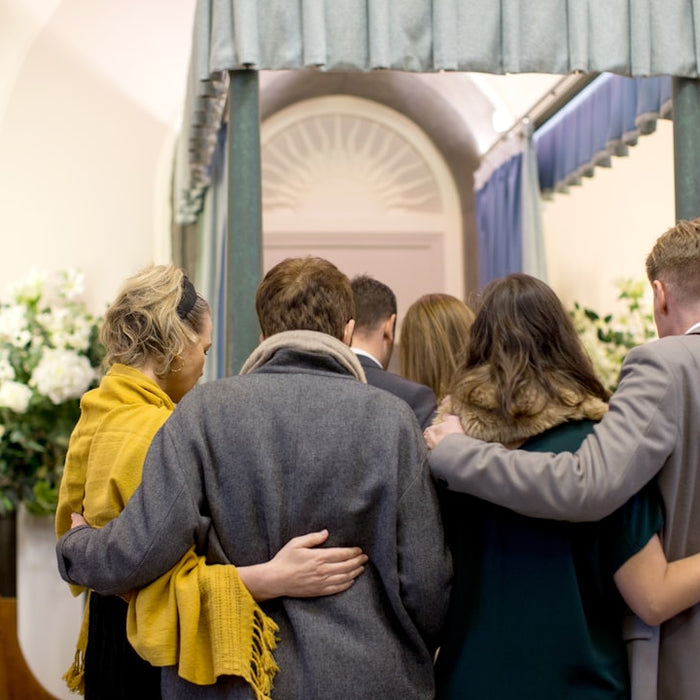 a group of people standing in front of a doorway