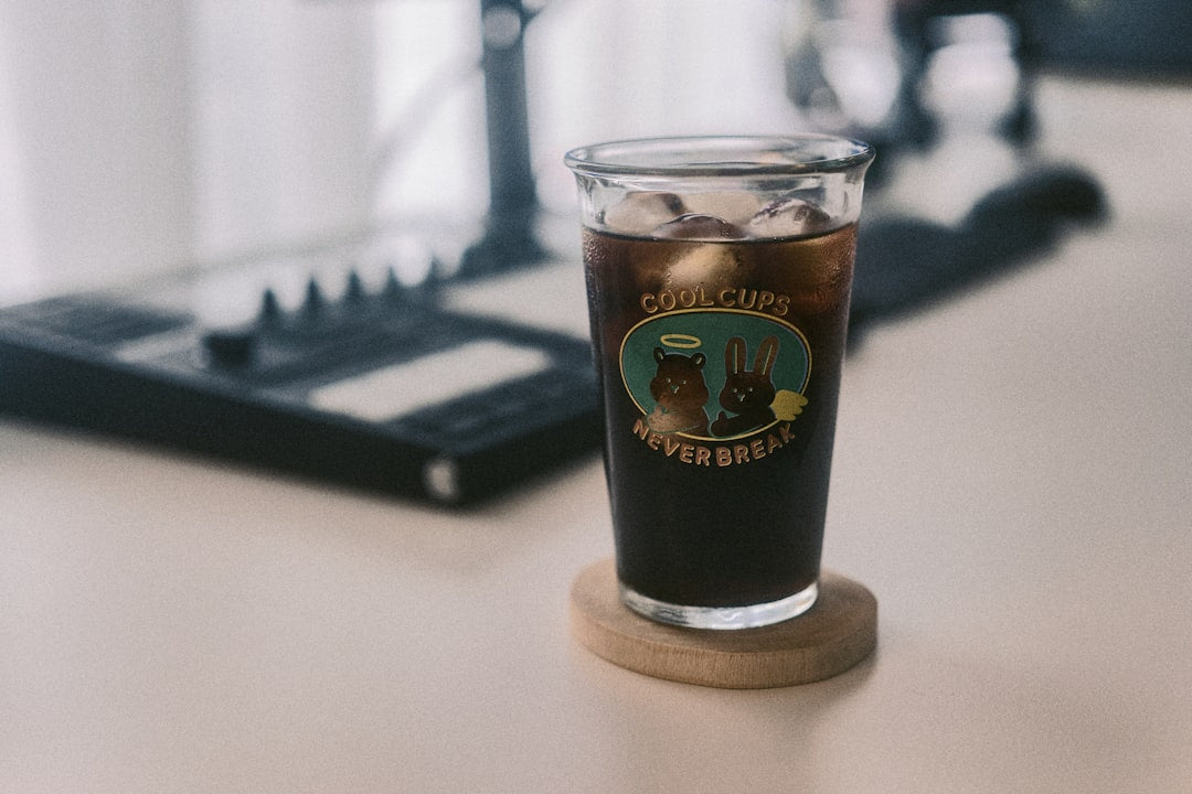 a cup of coffee sitting on top of a table