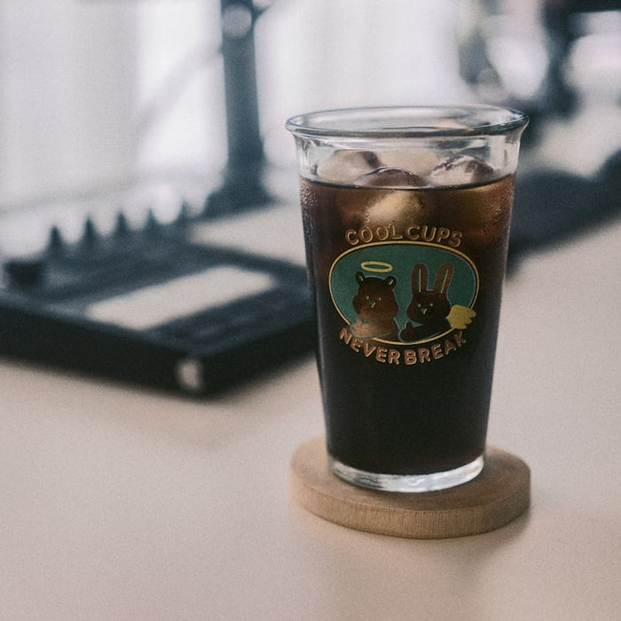a cup of coffee sitting on top of a table