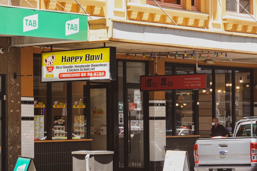 a happy bowl restaurant on a city street