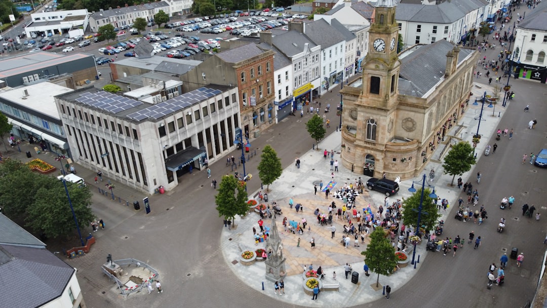 a large group of people gather in a city square
