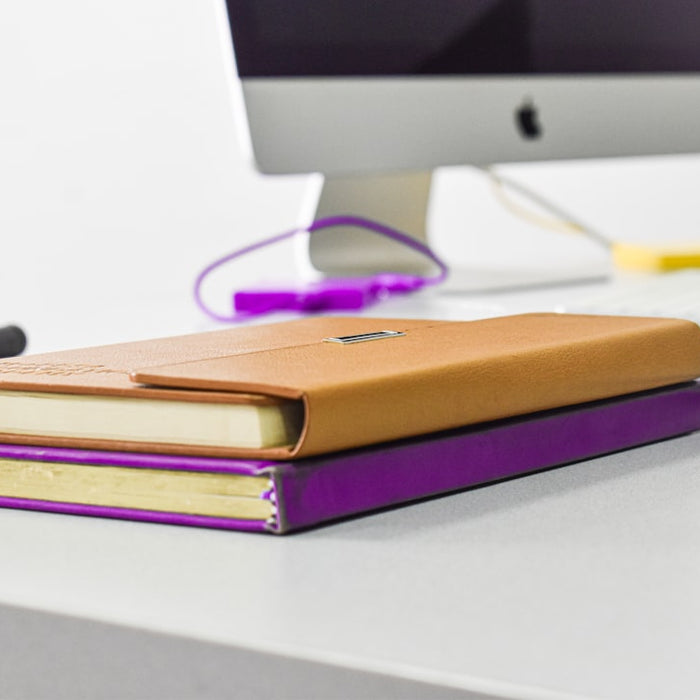 a stack of colored pencils