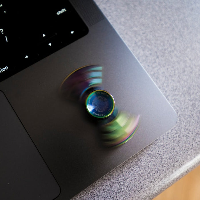 a blurry picture of a cd on top of a laptop