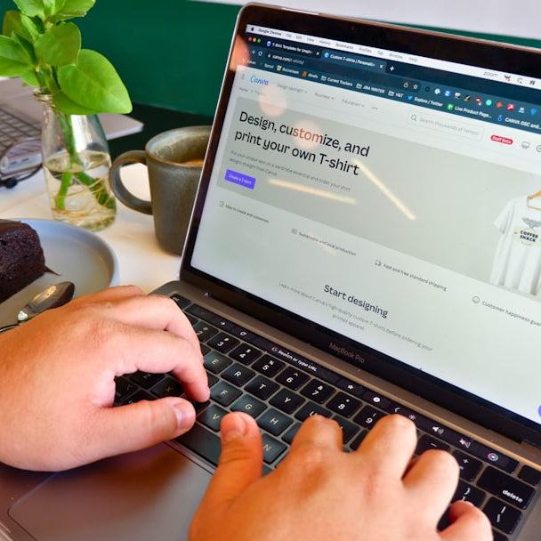 a person typing on a laptop at a table