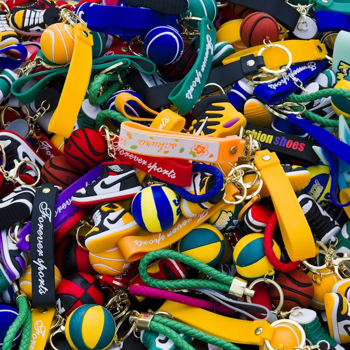 a large pile of assorted colorful key chains