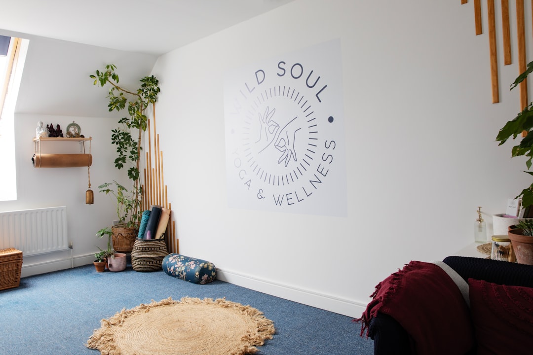 A room with a blue carpet and a white wall