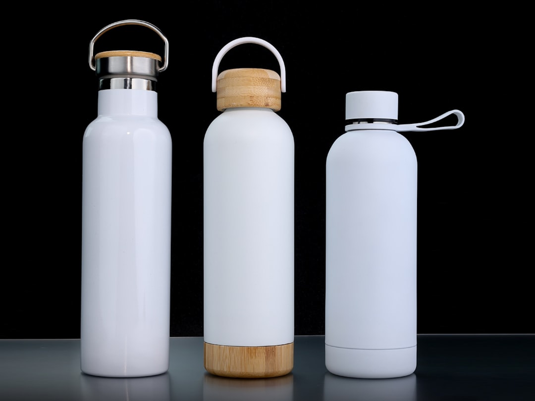 Three white water bottles are displayed.
