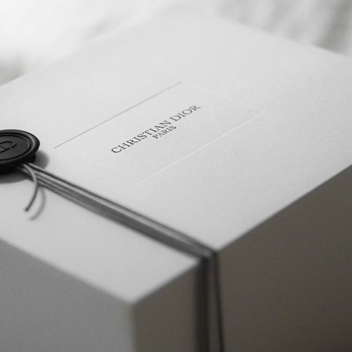 White dior gift box with black wax seal
