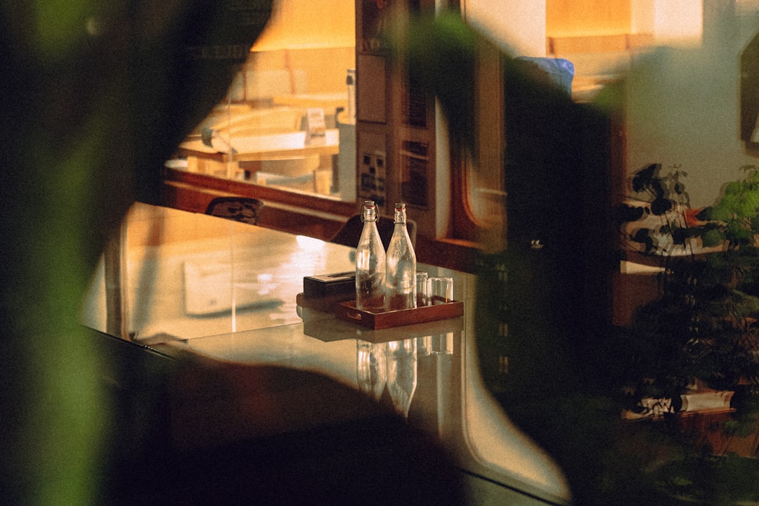 Two glass bottles and glasses on a tray