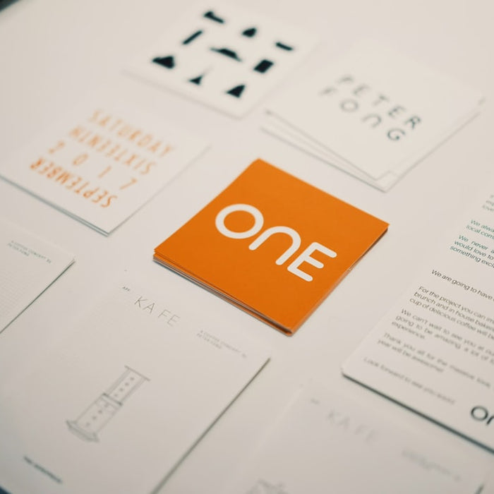 Orange card with "one" logo surrounded by other cards