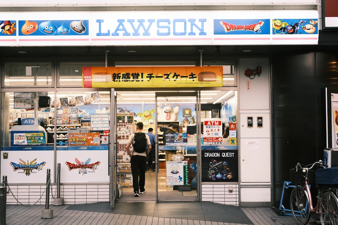 A person enters a lawson convenience store in japan.