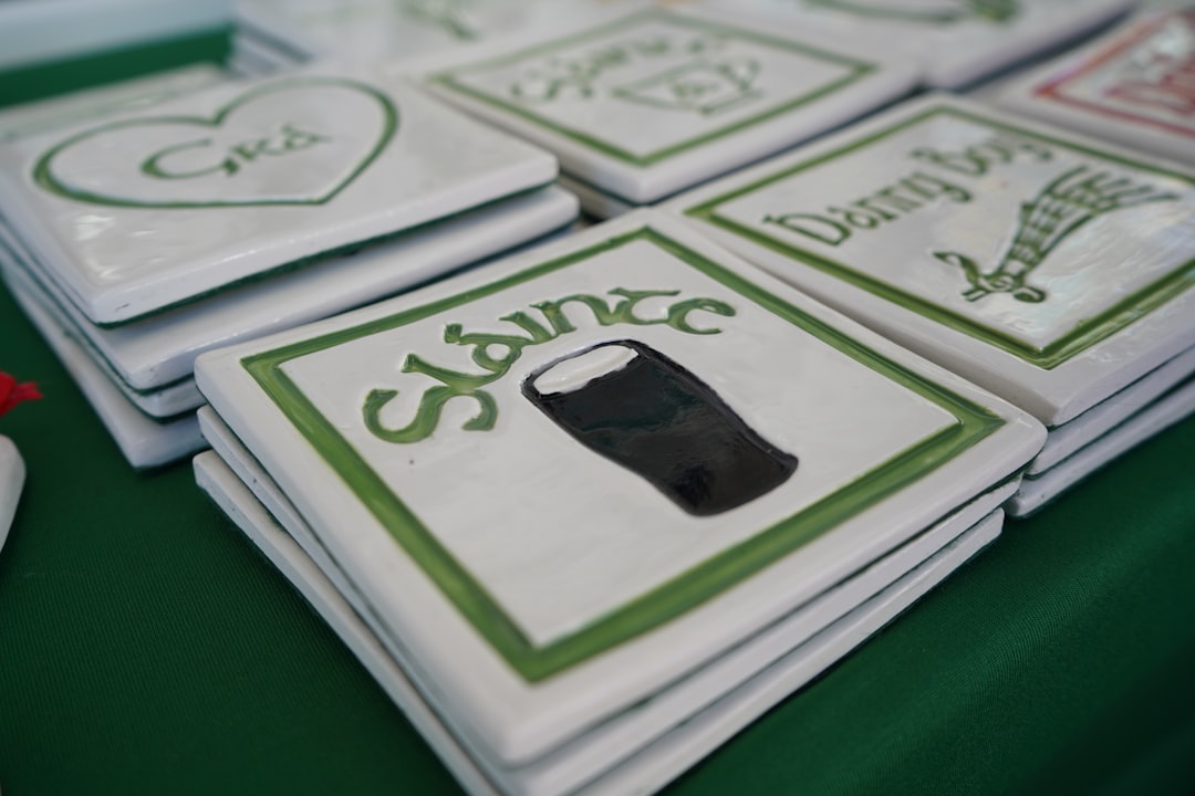 Stack of irish themed coasters with green designs