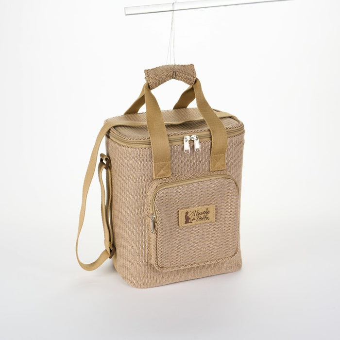 A beige woven cooler bag with a shoulder strap hanging against a white background