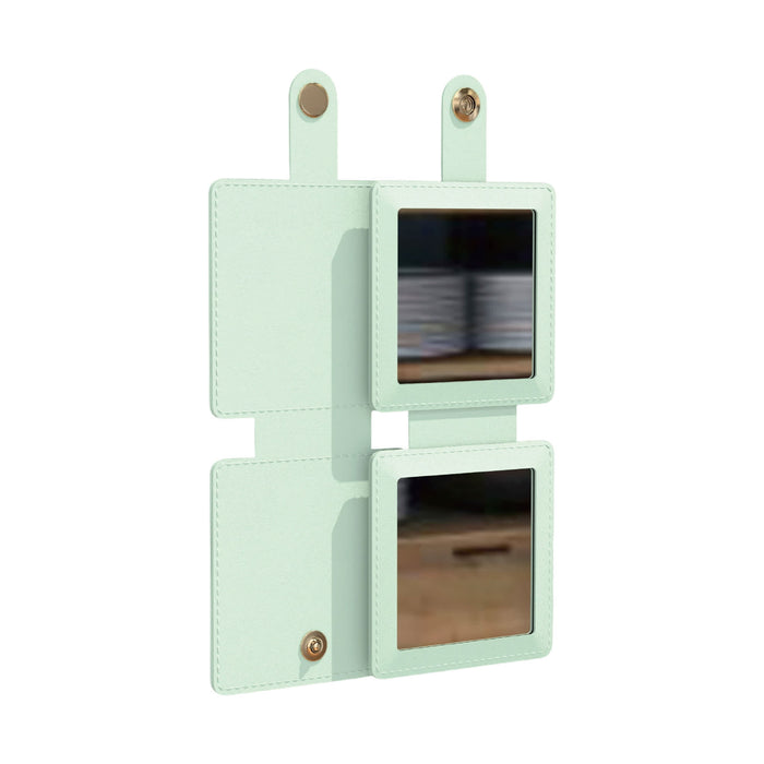 Suqare Folding Pocket Mirror - A square folding pocket mirror in mint green with two reflective surfaces and a fastening tab.