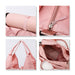 Duffle Bag With Yoga Mat Strap - A pink duffle bag featuring a yoga mat strap, zip closure, and multiple interior pockets. Includes a logo on the bag.