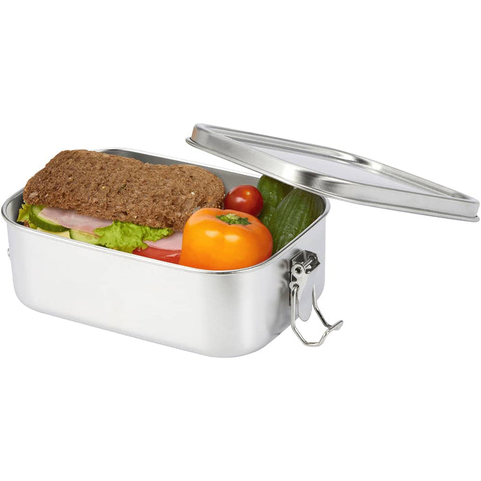 Seasons Titan Recycled Stainless Steel Lunch Box - A stainless steel lunch box with a silver finish, containing a sandwich, tomatoes, cucumber, and a small orange.