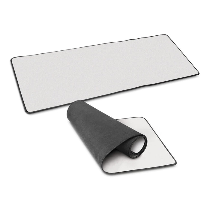 Jumbo Desk Mat - A Jumbo Desk Mat in white with a black border, displayed flat and rolled up partially to show both sides.