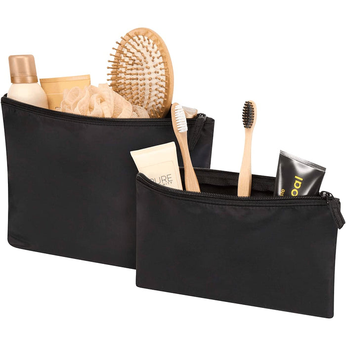 Swift GRS Recycled Toiletry Bag Set - A set of two black toiletry bags filled with various grooming products, including a hairbrush, lotion, and toothbrushes.