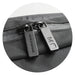 Moleskine Metro Slim Backpack - A zip detail of a black Moleskine Metro Slim Backpack featuring dual zippers and a textured surface.