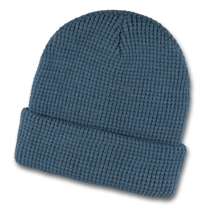 Galway Waffle Beanie - A blue waffle beanie featuring a ribbed texture and a folded cuff, with a logo on the side.
