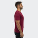 TRENDSWEAR Element Unisex T-Shirt - A unisex TRENDSWEAR Element T-shirt in maroon, viewed from the side, featuring a simple design and branding.