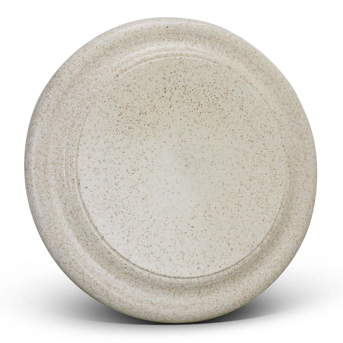 Choice Flyer - Large - A large, speckled beige plate with a smooth surface and a raised edge, featuring a subtle logo.