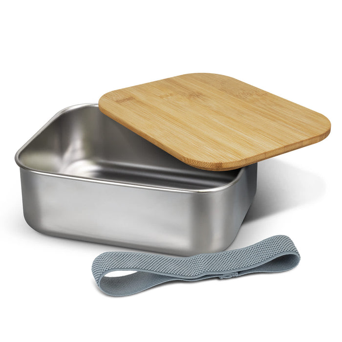 NATURA Stainless Steel Lunch Box - A stainless steel lunch box with a bamboo lid and a grey elastic strap, featuring a sleek design.