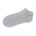 June Ankle Socks - A grey ankle sock with a soft texture and a logo on the side.