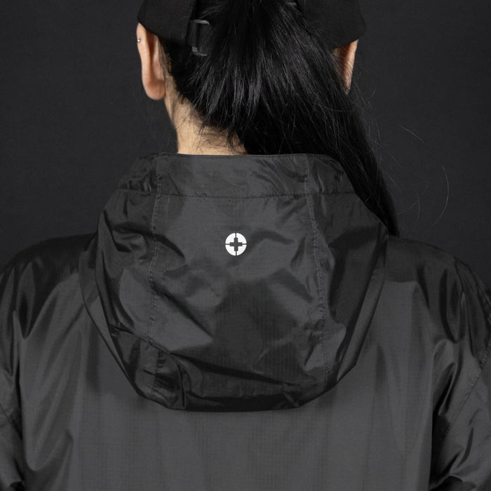 Swiss Peak Urban Windbreaker - A black windbreaker jacket featuring a hood and a logo on the back.