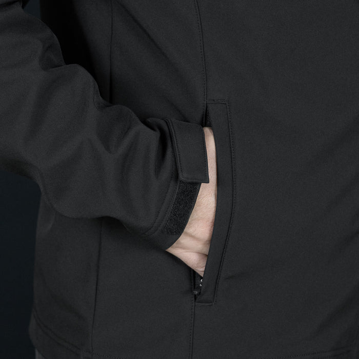 Swiss Peak Urban Softshell Jacket - A black softshell jacket featuring a zipped pocket and a smooth fabric texture. It has a logo on the surface.