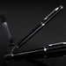 Swiss Peak Luzern Pen and Pencil Set - A black pen and pencil set with a sleek design, featuring metallic accents and a clear display case.