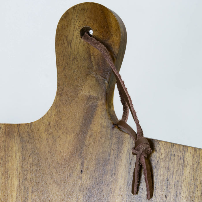 Keepsake Recipe Book Holder - A wooden recipe book holder with a hanging loop, featuring a natural brown finish and a leather tie.