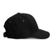 Essence Organic Cap - A black cap with a curved brim, featuring ventilation eyelets and an adjustable strap at the back.