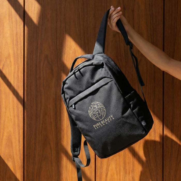 Oceana Recycled Backpack - A black recycled backpack with a logo, displayed against a wooden background.