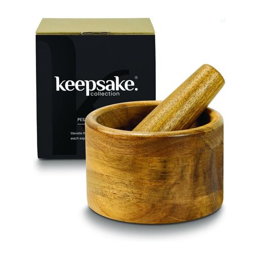 Keepsake Mortar & Pestle - A wooden mortar and pestle set in a round bowl, displayed with a black box featuring a logo.