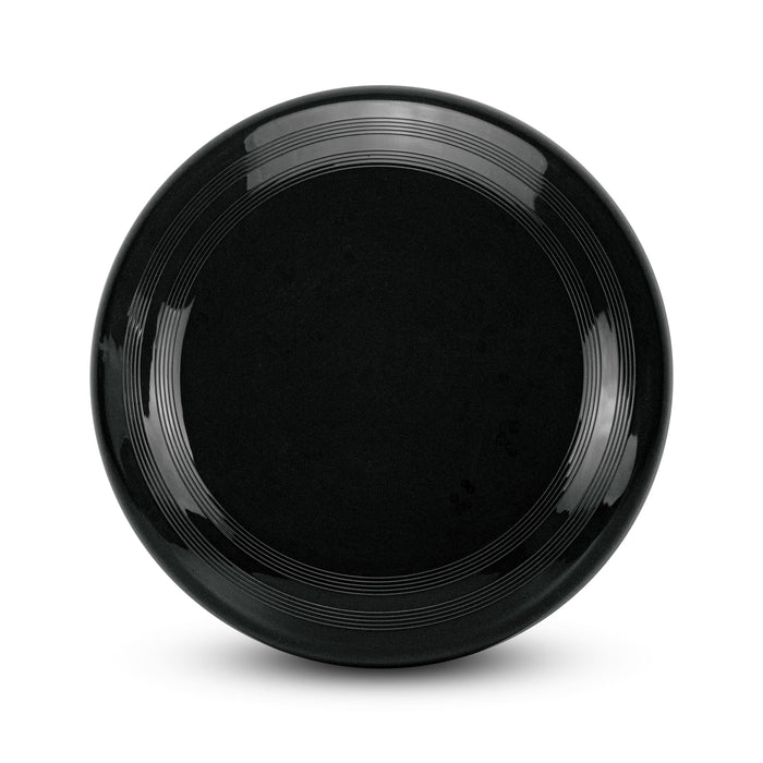 Aero Flyer - Large - A frisbee in solid black with a smooth surface and circular design, featuring subtle textured rings around the edge.