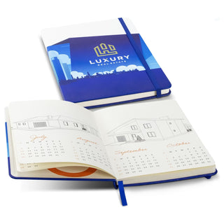 Ashbury Full Colour Notebook - A full-colour blue notebook with an elastic closure, featuring a calendar layout inside and a logo on the cover.