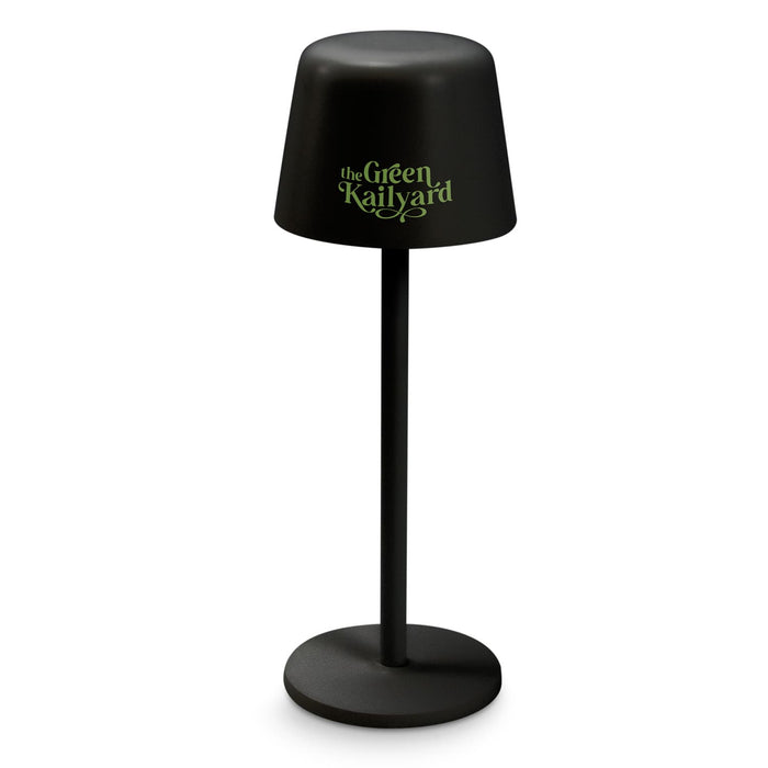 Ember Rechargeable Table Lamp - A black rechargeable table lamp with a round base and a cylindrical shade featuring a logo.