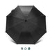SPICE Waste2Gear Umbrella - A black umbrella with a sleek design and a handle, featuring a logo on the fabric.