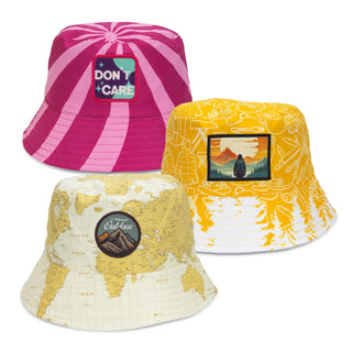 Sonny Custom Bucket Hat with Full Colour Patch - A custom bucket hat featuring a pink design with stripes, a yellow design with a landscape patch, and a map-patterned design.