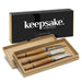 Keepsake Luca Cheese Knives - A set of three cheese knives with wooden handles in a gift box, featuring a black branding logo.