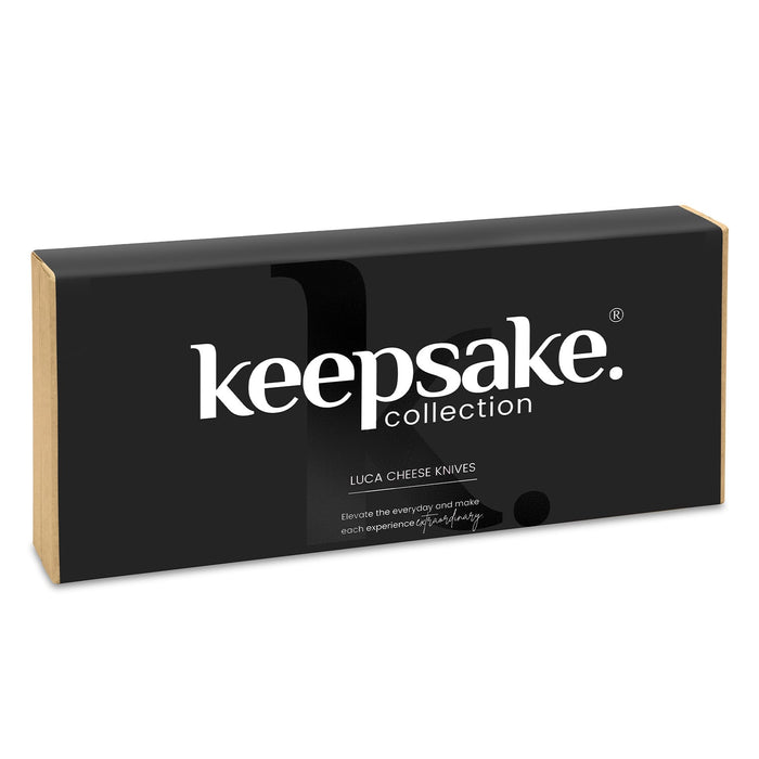 Keepsake Luca Cheese Knives - A black box containing Keepsake Luca cheese knives with gold accents, featuring a logo on the front.